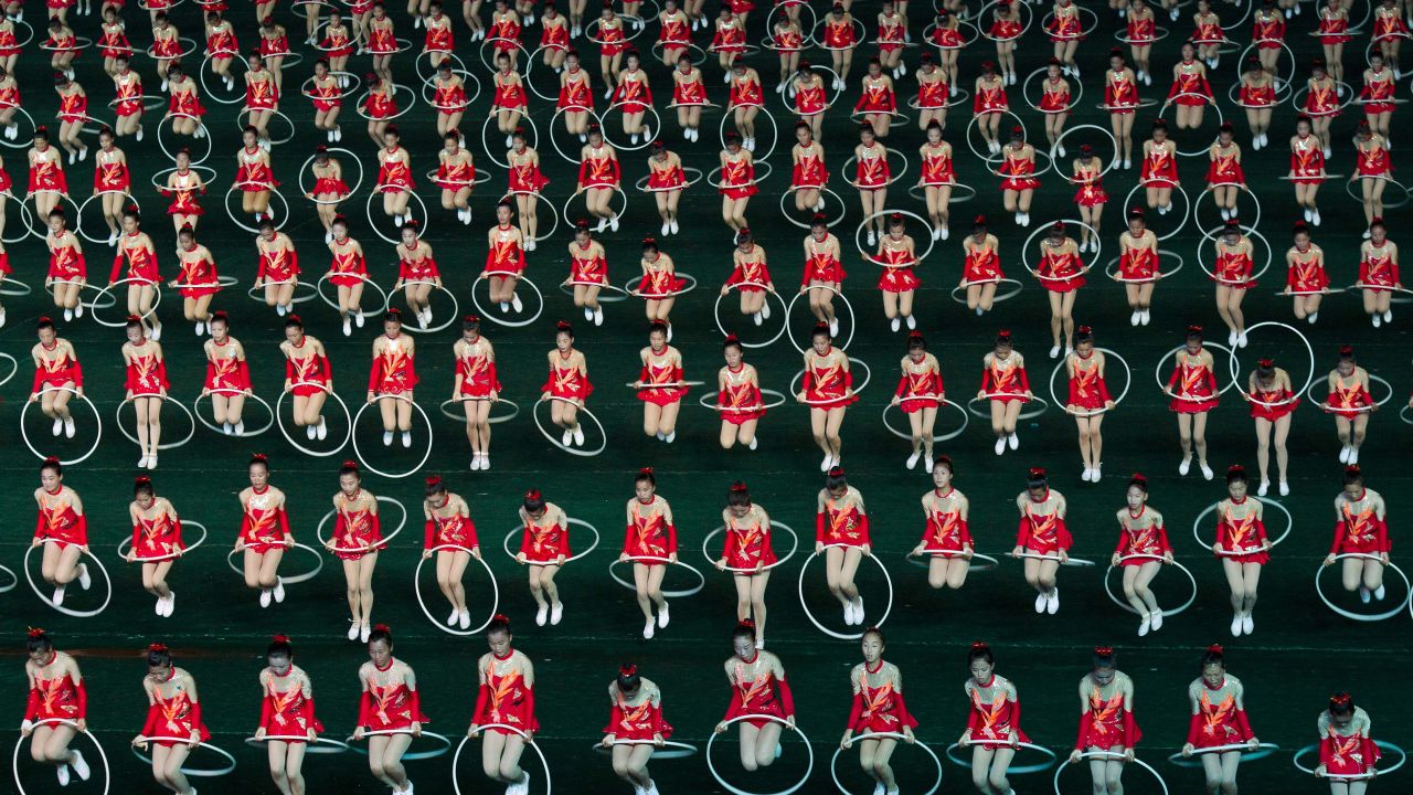 Women jump through hula hoops during the opening night of the annual Arirang Festival, or "mass games," at Pyongyang's May Day Stadium on Monday, July 22. 