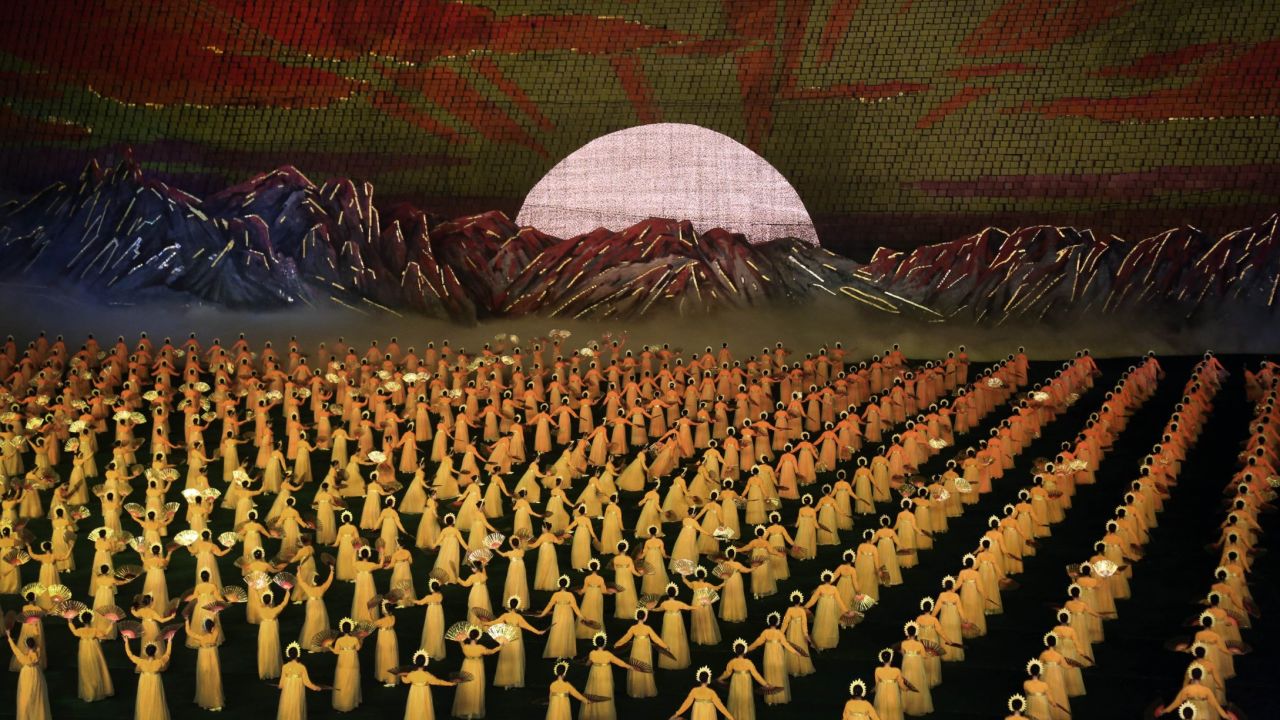 North Korean dancers perform during the Arirang Festival in Pyongyang on July 22. This year's performance was timed to debut for the 60th anniversary on July 27 and features new scenes focusing on leader Kim Jong Un's directives.