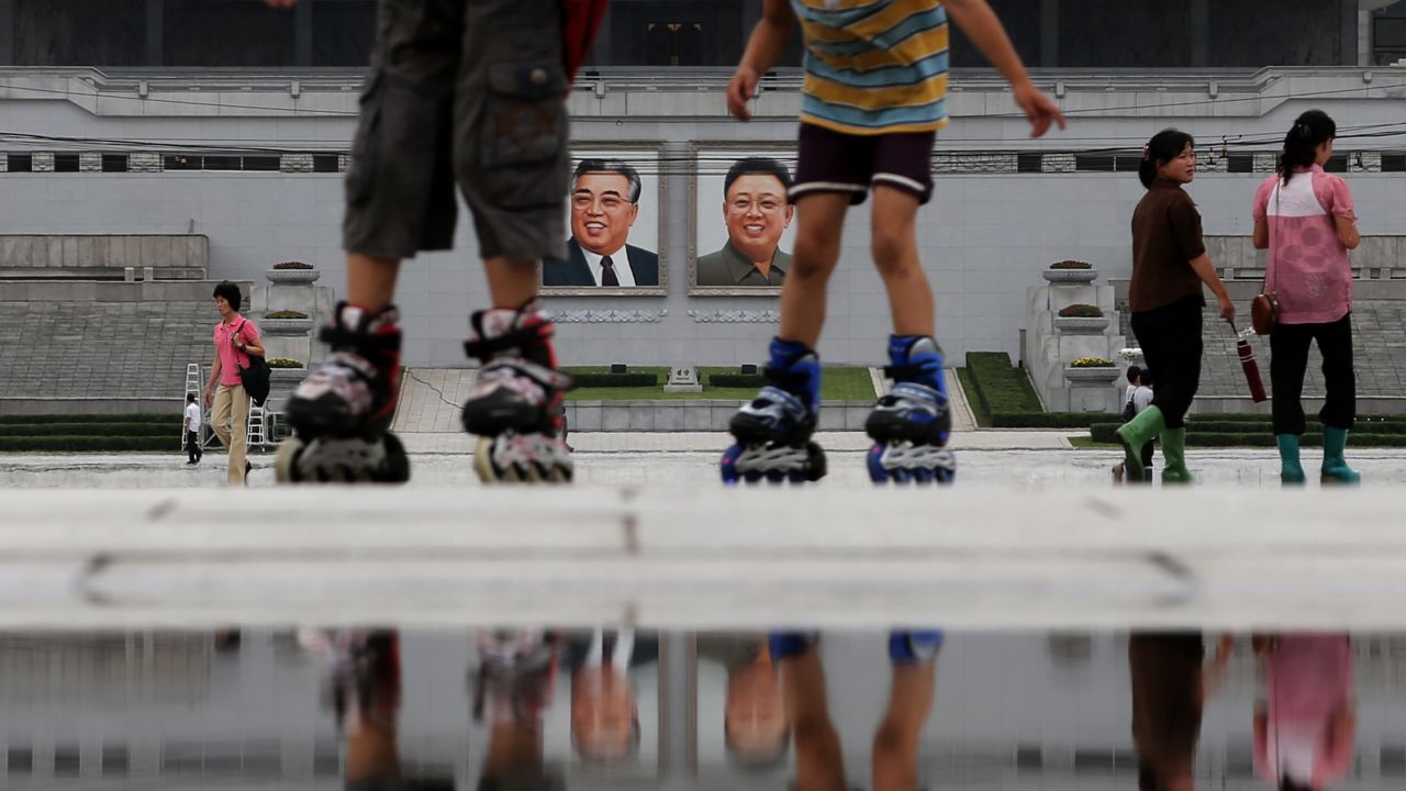 Children skate around the Kim Il Sung Square on July 21 in downtown Pyongyang.
