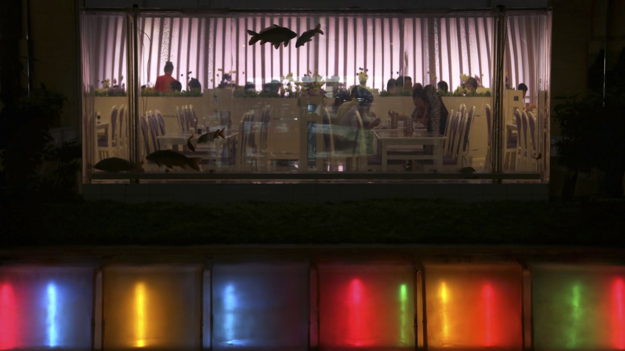 People dine in a restaurant at the Koryo hotel on July 21 in downtown Pyongyang.