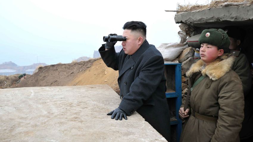 This picture, taken by North Korea's official Korean Central News Agency on March 7, 2013 shows North Korean leader Kim Jong Un (C) using a pair of binocular to look south as he inspects Jangjae Islet Defence Detachment near South Korea's Taeyonphyong Island in South Hwanghae province, North Korea's southwestern sector of the front.   AFP PHOTO / KCNA via KNS ---EDITORS NOTE--- RESTRICTED TO EDITORIAL USE - MANDATORY CREDIT "AFP PHOTO / KCNA VIA KNS" - NO MARKETING NO ADVERTISING CAMPAIGNS - DISTRIBUTED AS A SERVICE TO CLIENTS        (Photo credit should read KNS/AFP/Getty Images)