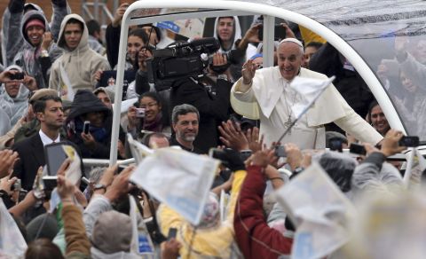 Pope Francis waves to pilgrims as he arrives at the Basilica of Our Lady of Aparecida on July 24.