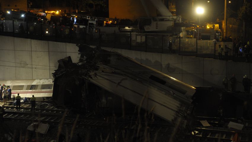 A picture taken on July 24, 2013 shows derailed cars on the site of a train accident near the city of Santiago de Compostela. Up to a dozen people died when a train derailed in northwestern Spain today, media reports quoting witnesses said. The train which carried 238 passengers originated in Madrid and was bound for the northwestern town of Ferrol. AFP PHOTO / MIGUEL RIOPAMIGUEL RIOPA/AFP/Getty Images