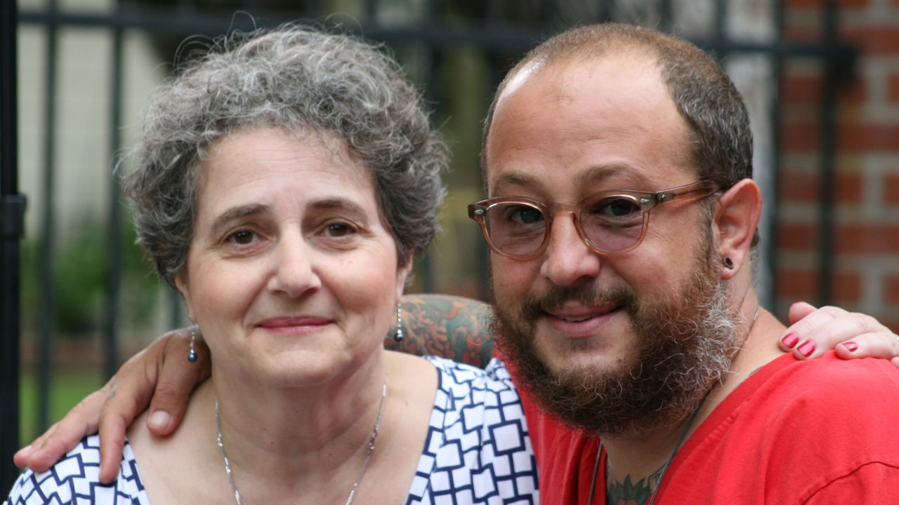 Kevin was raised by his grandparents and is seen here today with his aunt, Sylvie de Toledo.