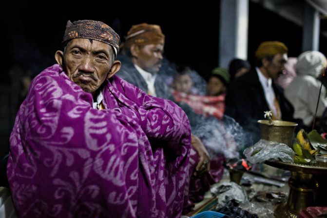 JULY 25 - PROBOLINGGO, INDONESIA: A shaman sits at a temple during the Yadnya Kasada celebration at crater of Mount Bromo in Indonesia. The festival is the main event of the Tenggerese people, a 600,000-strong isolated community living East-Central Java.