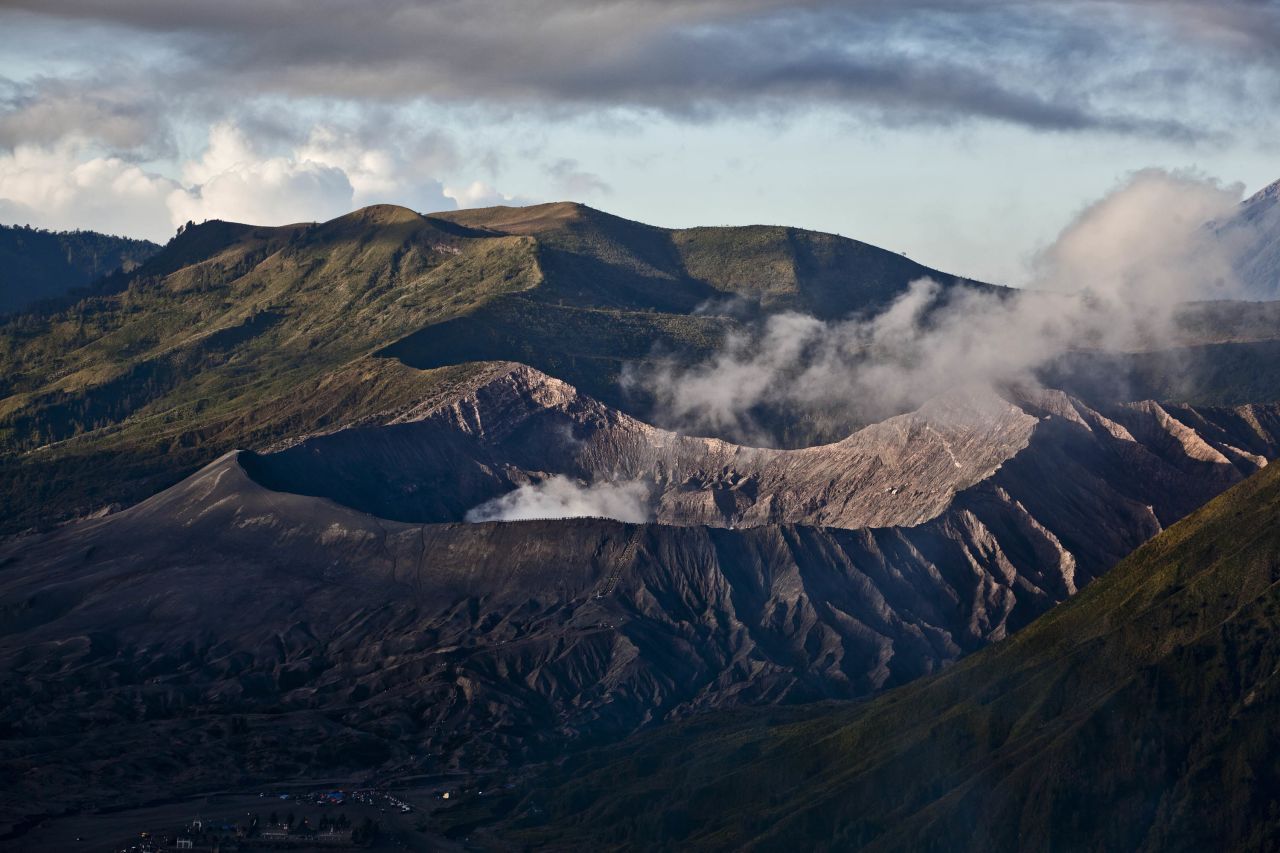 The Bromo Tengger Semeru National Park, with Mount Bromo in the background, is the location of the Tenggerese villages where the Yadnya Kasada Festival is held.