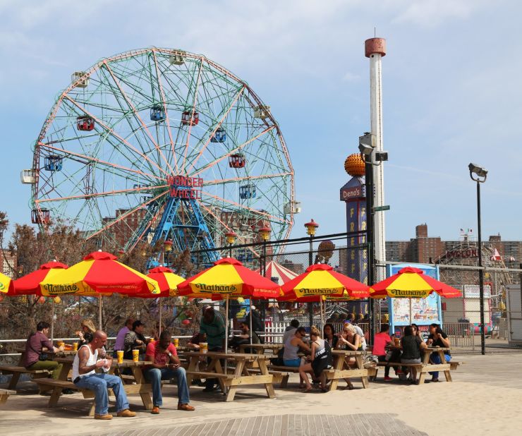 Coney Island's iconic Wonder Wheel looms over the boardwalk and amusement park