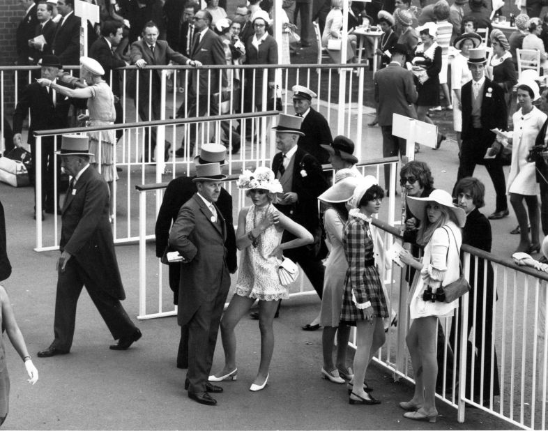 Swinging sixties fashion mixes with the traditional top hat in this shot taken at Royal Ascot in 1968. 