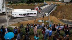 SANTIAGO DE COMPOSTELA, SPAIN - JULY 25: TV Journalists report from a vegetable plot near a train crash that killed at least 80 people on July 25, 2013 at Angrois near Santiago de Compostela, Spain. The crash occurred as the train approached the north-western Spanish city of Santiago de Compostela at 8.40pm on July 24th, at least 80 people have died and a further 131 reported injured. The crash occured on the eve of the Santiago de Compostela Festivities. (Photo by Pablo Blazquez Dominguez/Getty Images)