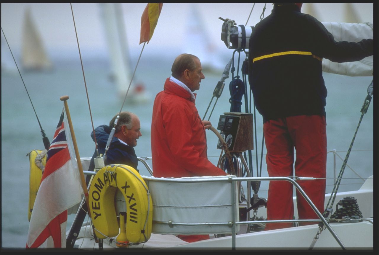 Royal patronage: The Duke of Edinburgh takes the helm as he takes part in the 1994 Cowes Week in southern England.