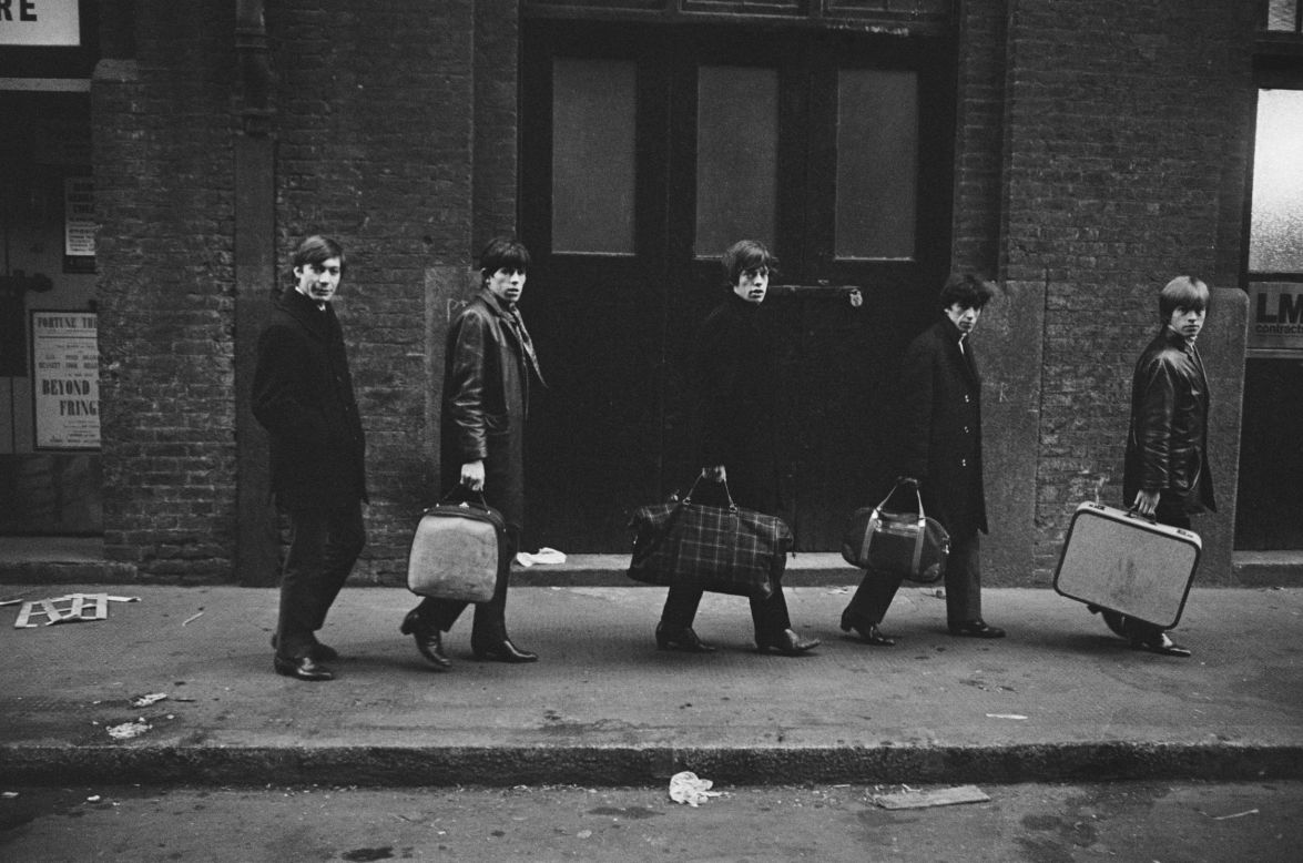 From left, Charlie Watts, Keith Richards, Mick Jagger, Bill Wyman and Brian Jones carry their bags past London's Donmar Rehearsal Theatre in 1963.