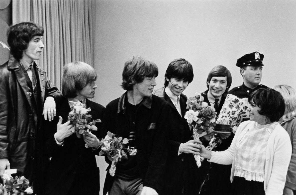 The Rolling Stones receive bouquets from fans in New York during their first US tour in June 1964.