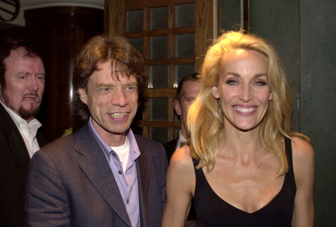 Jagger and Jerry Hall leave The Ivy Restaurant in London after Hall's debut in the stage production of "The Graduate" in 2000.