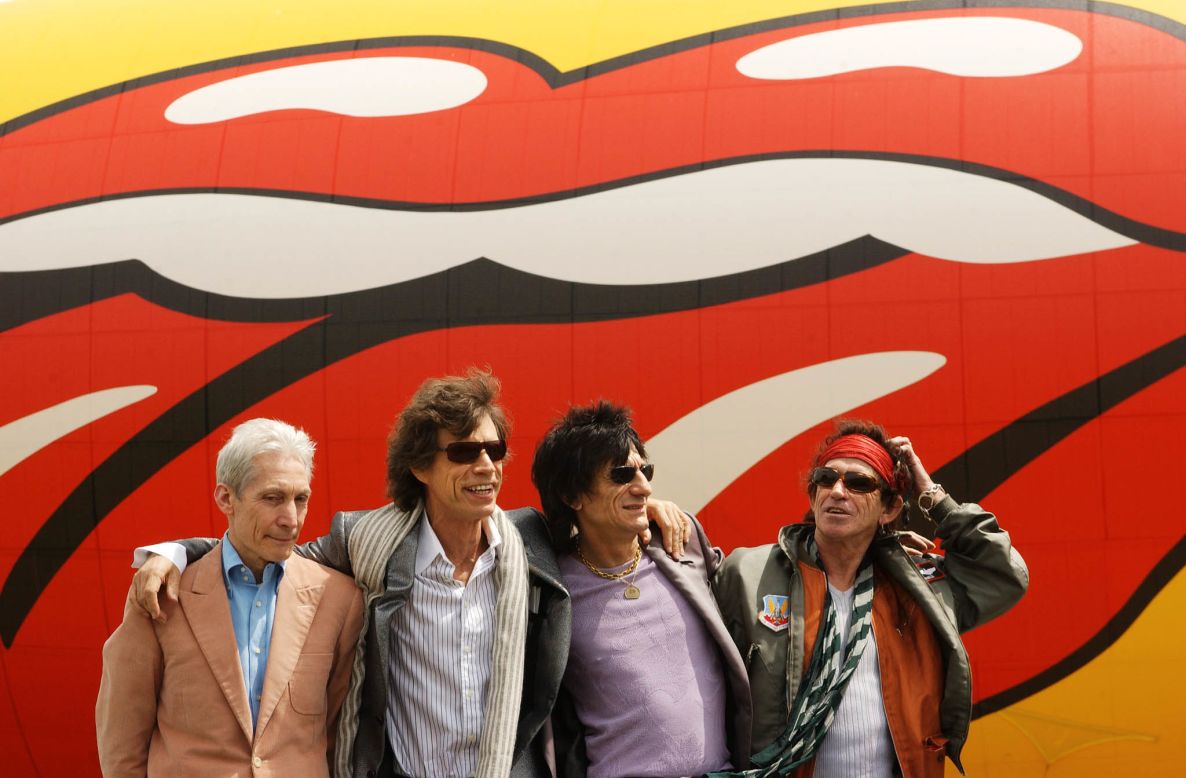 From left, Charlie Watts, Jagger, Ron Wood and Keith Richards pose in front of a Rolling Stones blimp after arriving in New York in 2002.