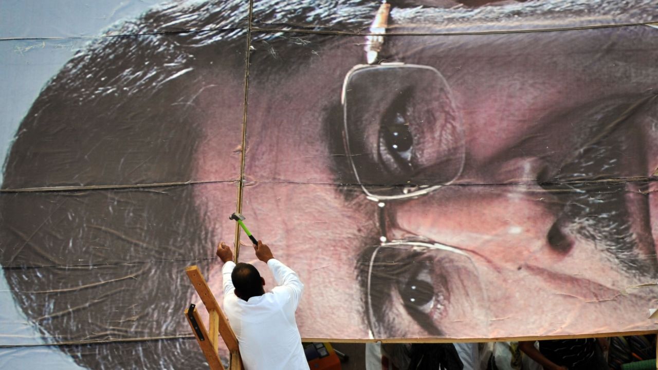 A Morsy advocate builds a giant portrait of the deposed president Thursday, July 25, while other supporters hold a sit-in outside a Cairo mosque. The military has detained Morsy while an interim government takes shape.
