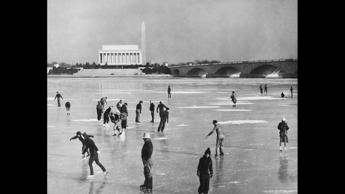 People skate on the frozen Potomac River in front of the memorial in this undated photo.