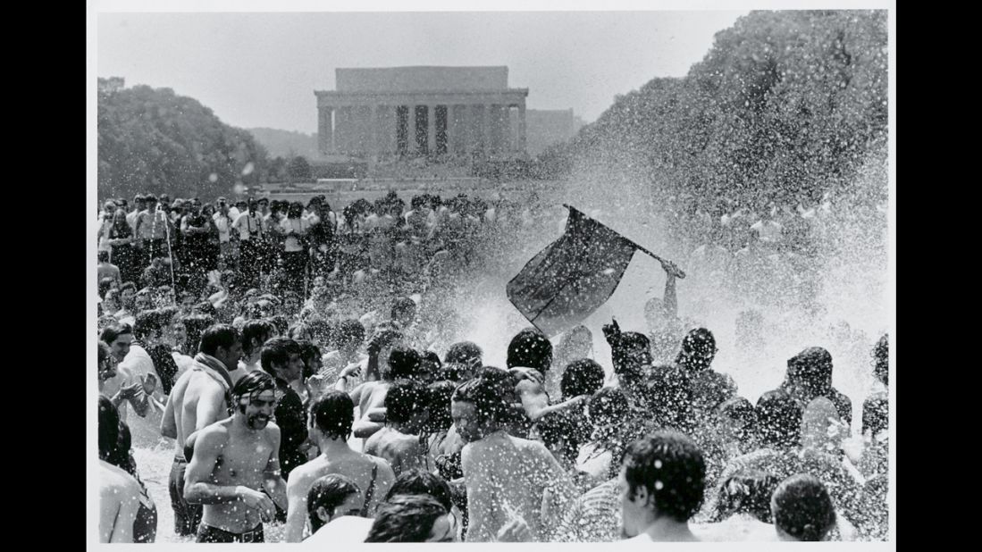 Anti-war protesters splash around in the Reflecting Pool during a rally against the Vietnam War in May 1970.