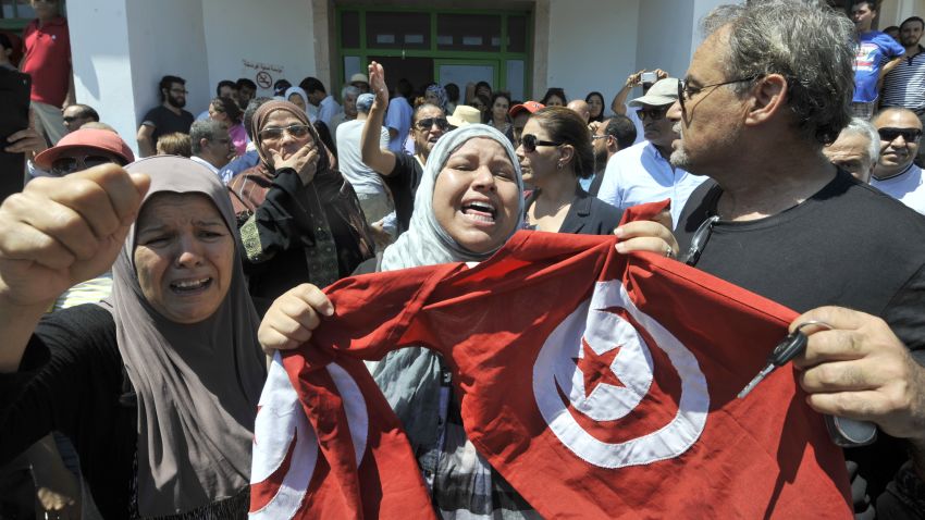 Tunisians gather outside a hospital after the killing of opposition politician Mohamed Brahmi on July 25, 2013 in Ariana, outside Tunis.