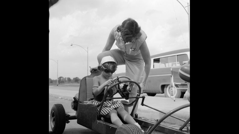 A mother gives her child advice during a boxcar race in Livonia, Michigan, a Detroit suburb, circa 1955. The move to the suburbs accelerated, especially after rioting that devastated Detroit in 1967.