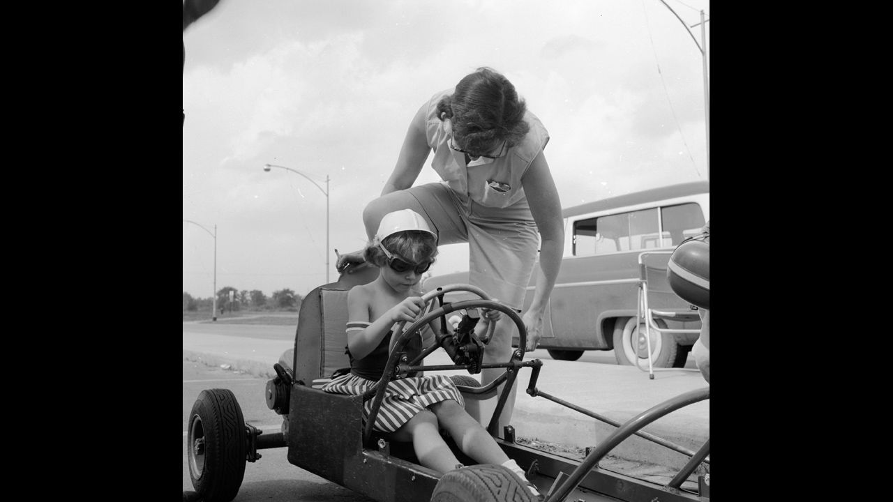 A mother gives her child advice during a boxcar race in Livonia, Michigan, a Detroit suburb, circa 1955. The move to the suburbs accelerated, especially after rioting that devastated Detroit in 1967.