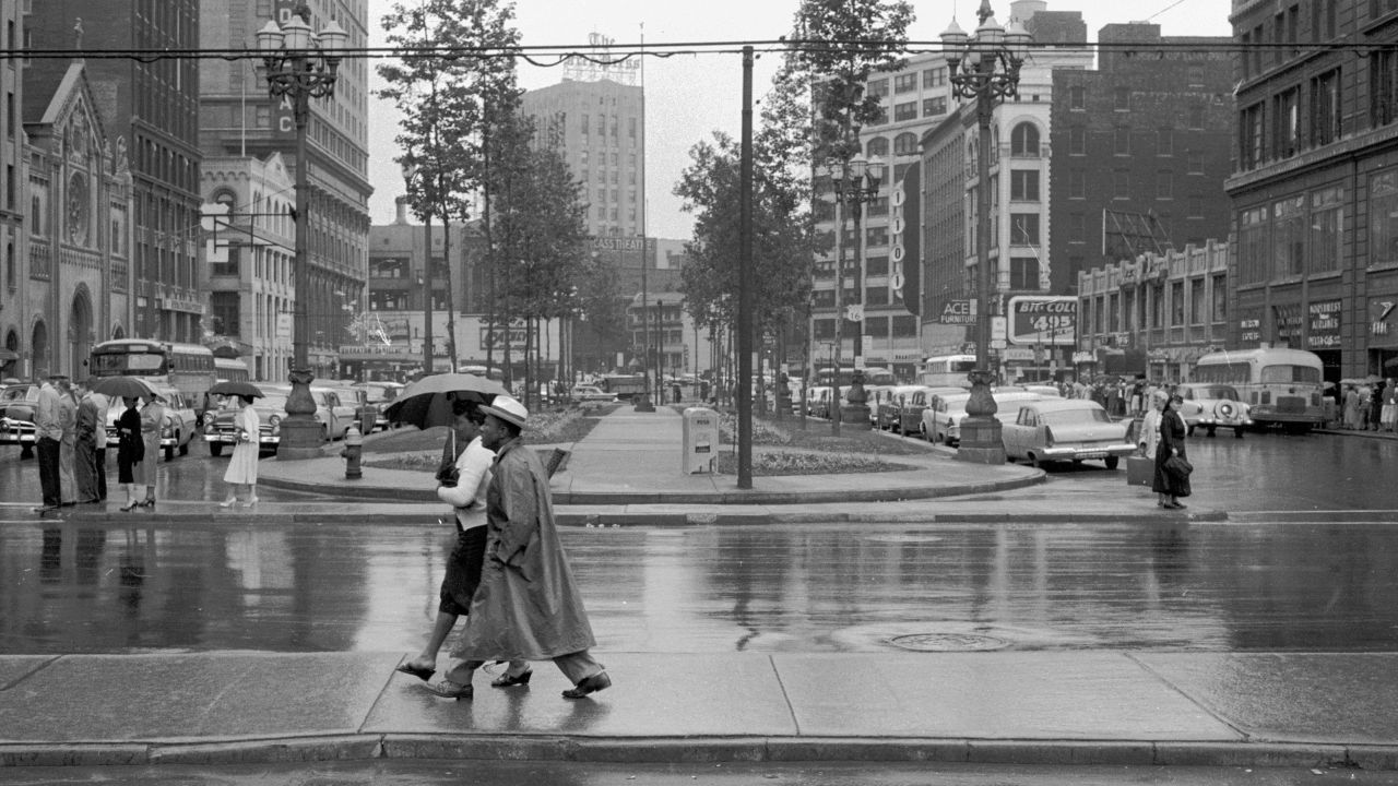 Downtown Detroit is full of people on a rainy afternoon circa 1955. Looking at old photos of the Motor City, Ewing says she always was a bit envious of the city life that eluded her and her siblings who grew up in the suburbs.