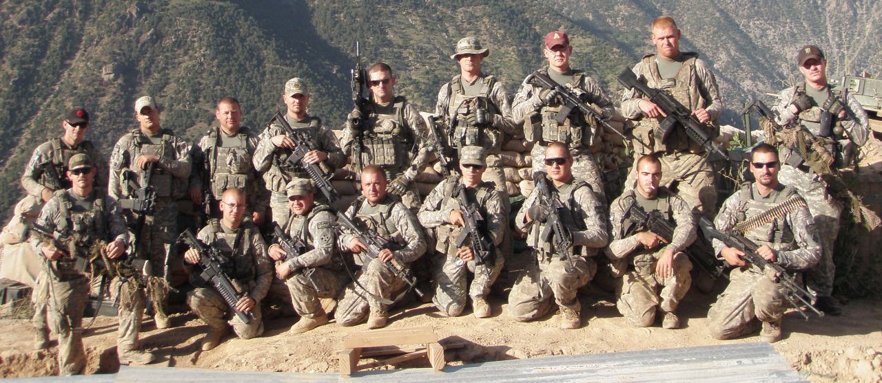 Carter poses with his comrades from Blue Platoon, also known as "The Bastards," at Observation Post Fritsche in Afghanistan. 