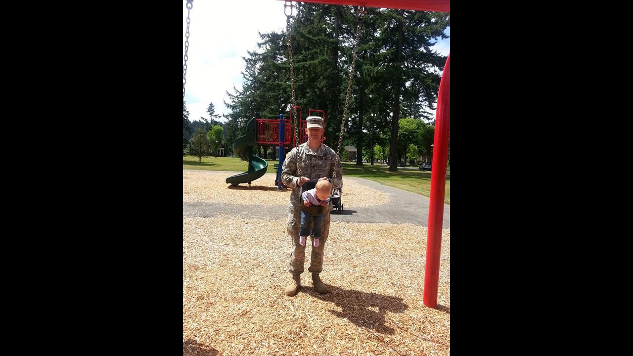 Carter plays with his daughter Sehara Carter at a park at Joint Base Lewis-McChord in Washington state in early July 2013.
