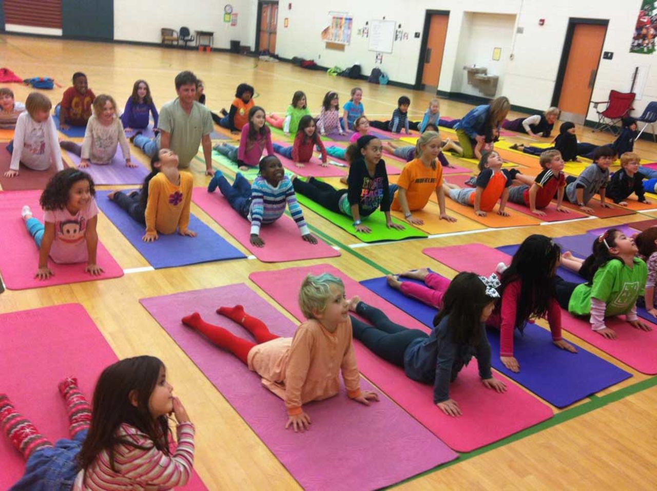 Elementary school students in Dekalb County, Georgia, practice the cobra pose, which is designed to relieve discomfort in the muscles of the back, neck and abdomen. It also aims to alleviate stress, anxiety and depression. 