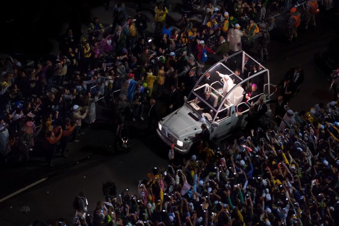 JULY 26 - RIO DE JANEIRO, BRAZIL: Pope Francis arrives to celebrate Mass at Copacabana beach on July 25. The pontiff addressed <a href="http://religion.blogs.cnn.com/2013/07/25/in-address-to-youth-in-brazil-pope-francis-speaks-their-language/">about a million worshippers</a> at World Youth Day celebrations in Rio. His speech came at a time when <a href="http://cnn.com/2013/06/28/world/americas/brazil-protests-favelas">millions of Brazilians</a> have expressed discontent with their government.