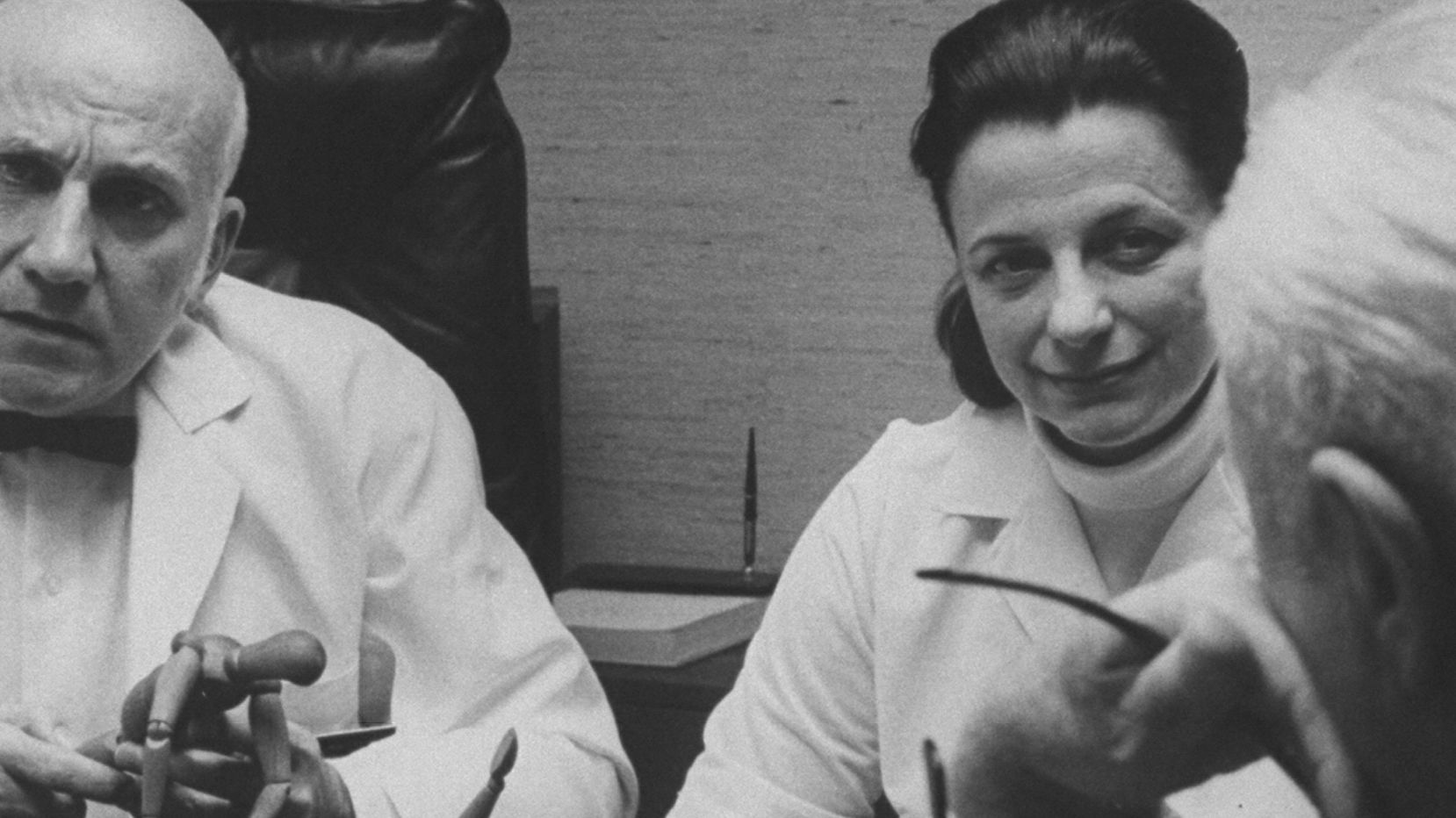 Virginia Johnson and her partner, William Masters, confer with patients during a marriage counseling session 