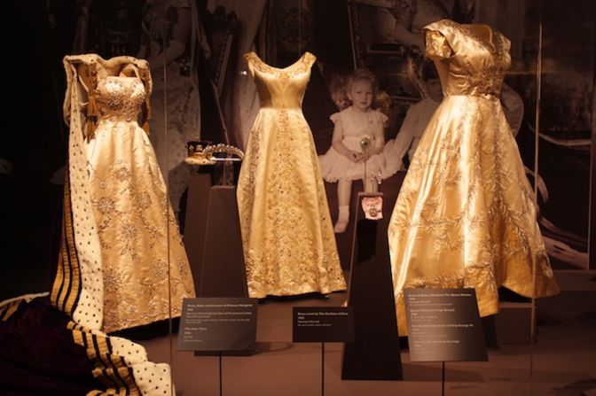 Dress, robe and coronet worn by Princess Margaret, dress worn by the Duchess of Kent, and dress of Queen Elizabeth The Queen Mother (from left to right).