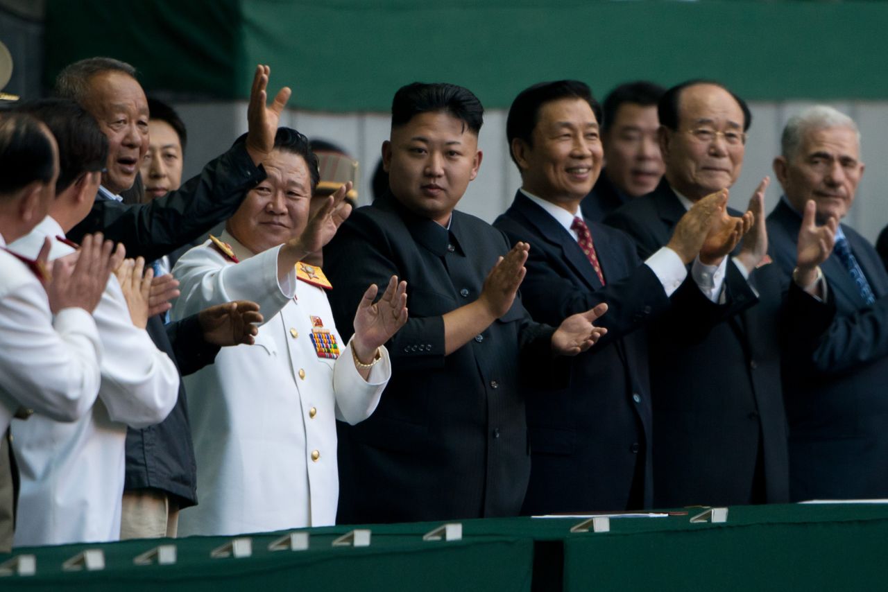 North Korean leader Kim Jong Un, center, applauds before the Arirang Festival at the 150,000-seat Rungrado May Day Stadium in Pyongyang on July 26.