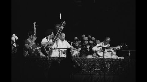 The Concert for Bangladesh takes place in August of 1971. Tanpura player Kamala Chakravarty, sitar player Ravi Shankar, tabla player Alla Rakha and sarod player Ali Akbar Khan perform. 