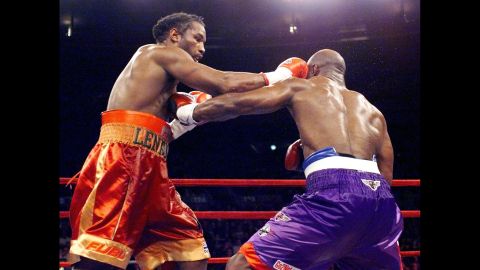 Evander Holyfield and Lennox Lewis fight their way to a draw in March 1999.
