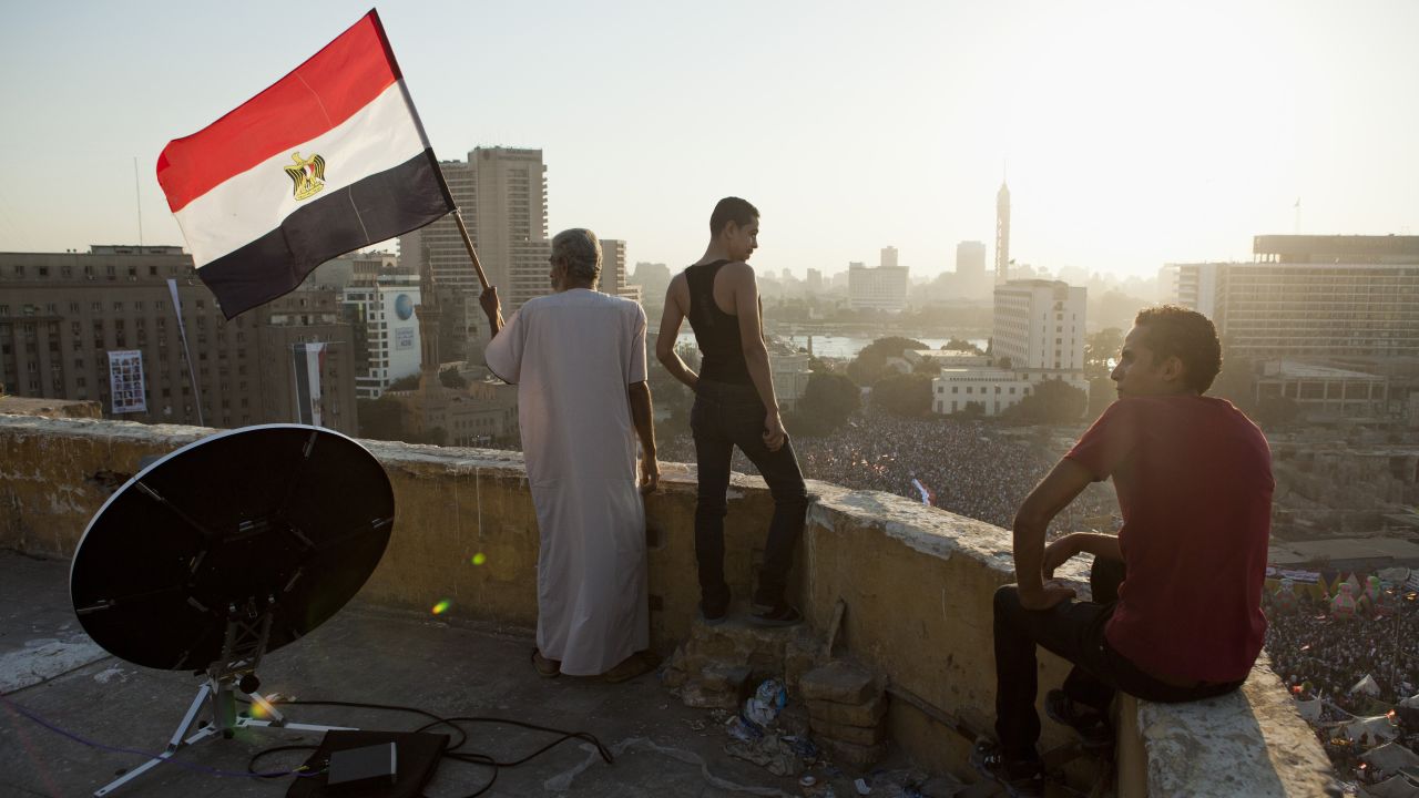 Morsy opponents watch a demonstration from a rooftop near Tahrir Square in Cairo on July 26.