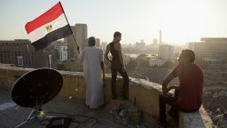 Morsy opponents watch a demonstration from a rooftop near Tahrir Square in Cairo, on July 26.