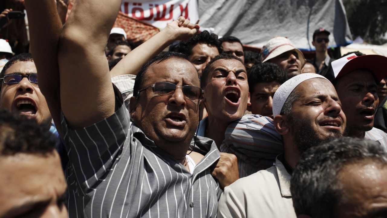 Supporters of Morsy protest outside a field hospital in Cairo where the bodies of slain Morsy supporters have been brought July 27.