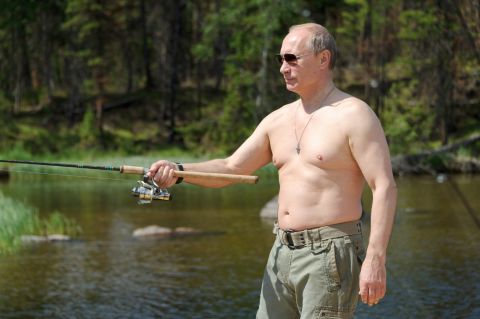 Putin enjoys some fishing during his vacation to the Tuva region on July 20, 2013.