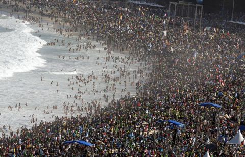 Hundreds of thousands of bathers, pilgrims and residents fill the beach at Copacabana Beach in Rio, where Pope Francis was to hold a prayer vigil on July 27.