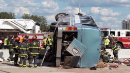 Firefighters work to extricate people from a bus crash Saturday, July 27, in Indianapolis. 