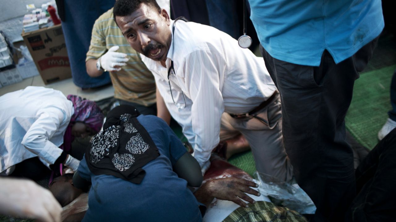Doctors treat an injured supporter of deposed Egyptian President Mohamed Morsy during clashes with security forces in Cairo on Saturday, July 27. 