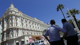 French policemen keep watch outside the Carlton Hotel in Cannes on July 28, 2013, after an armed man stole $53m of jewels.