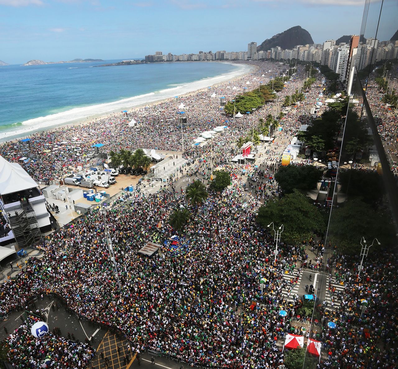 Faithful as far as the eye can see crowd Copacabana Beach on July 28, during Pope Francis' final Mass of his visit to Brazil. The stage from where the pope was speaking is seen on the lower left. 