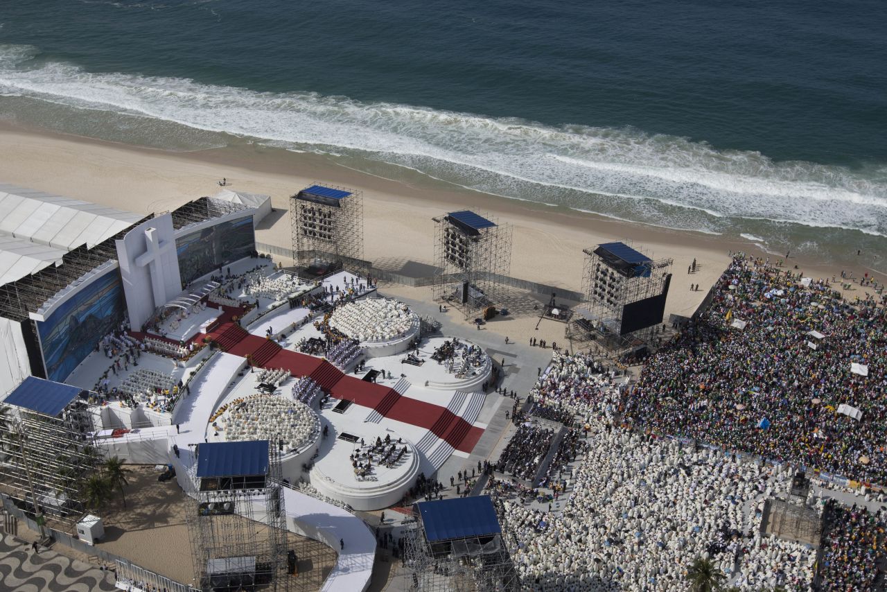 A bird's-eye view of the pope's stage is seen leading to a sea of priests dressed in white and then to the millions of faithful that turned out on Copacabana beach to witness the Mass.