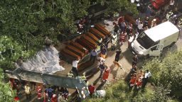 Rescuers prepare the coffins for victims of the crash on Sunday, July 28.
