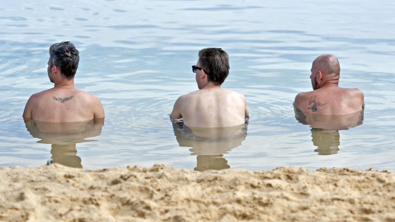 Men relax at a lake near Erfurt, Germany, on Sunday, July 28. 