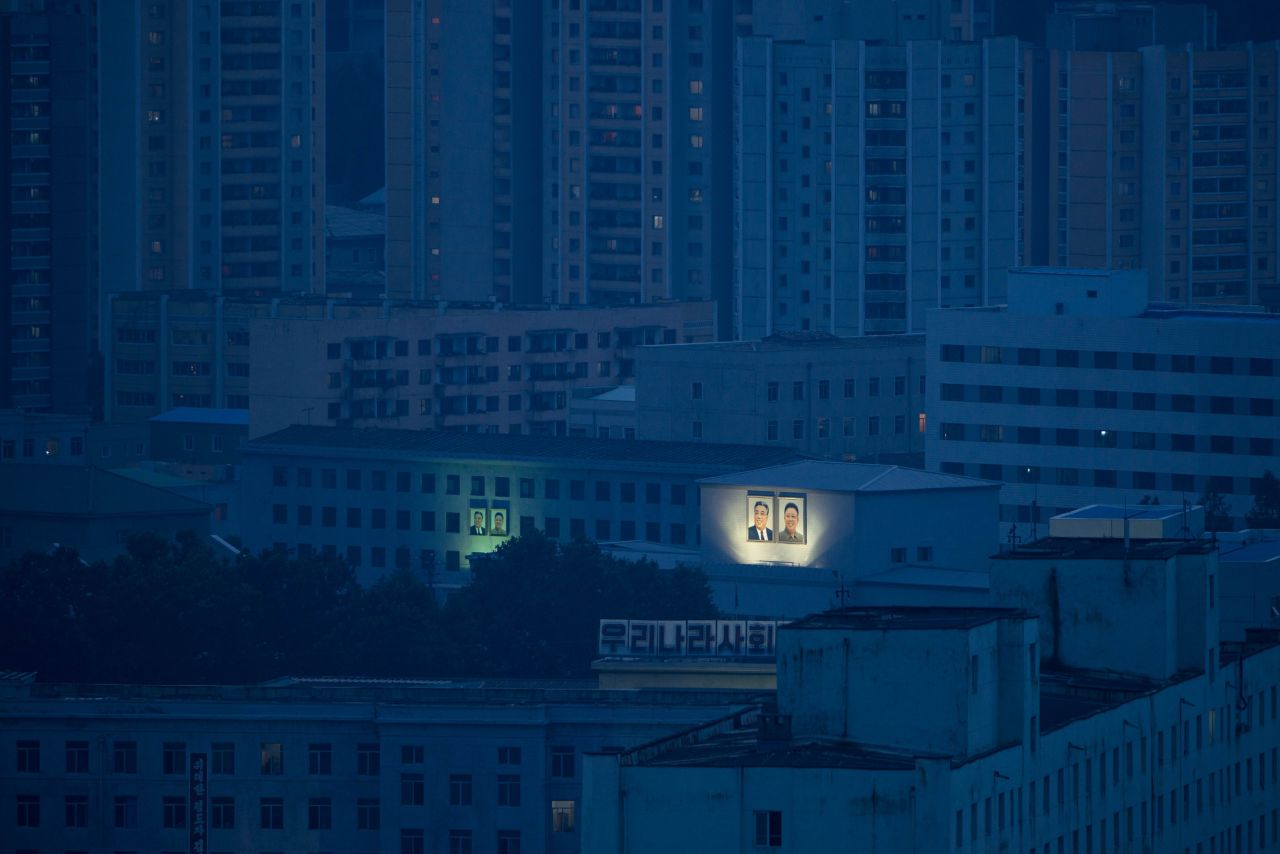 Portraits of former North Korean leaders Kim Il Sung and Kim Jong Il are displayed on Pyongyang buildings on July 27.
