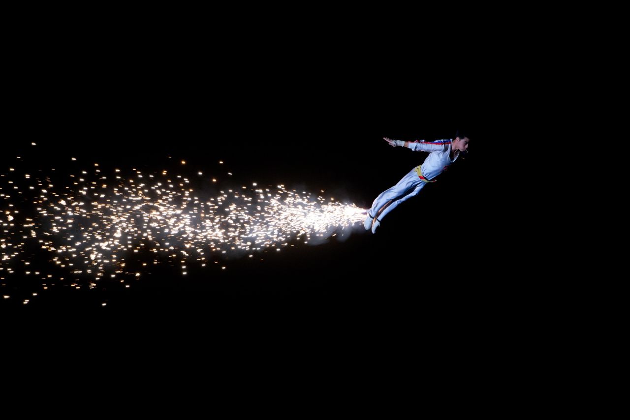 A performer jumps from a catapult during an Arrirang Festival at the Rungnado May Day Stadium on July 26. Arrirang performances feature 100,000 participants in a 90-minute display of gymnastics, dance, acrobatics and dramatic performance.