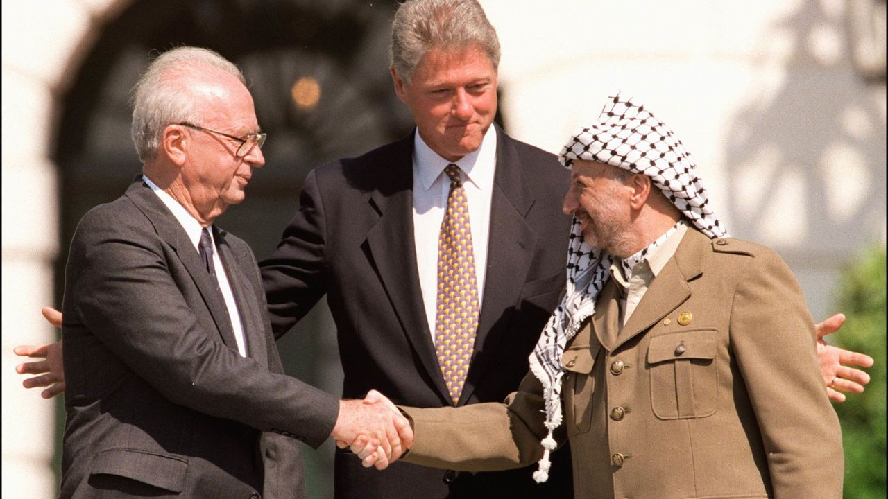 President Clinton stands between then-Israeli Prime Minister Yitzahk Rabin, left, and  Yasser Arafat at the White House on September 13, 1993. Rabin and Arafat shook hands for the first time after Israel and the Palestine Liberation Organization signed a historic agreement on Palestinian autonomy in the occupied territories. The peace process faltered after Rabin was assassinated by a Jewish extremist on November 4, 1995.