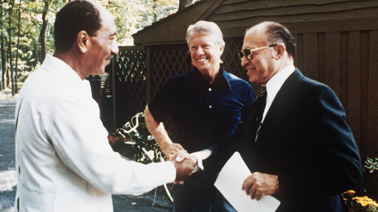 Then-Egyptian President Anwar Sadat, left, shakes hands with then-Israeli Prime Minister Menachem Begin, in the garden of Camp David on September 6, 1978. With the help of then-President Jimmy Carter, the Camp David Accords became the groundbreaking first-ever peace treaty between Israel and Egypt.